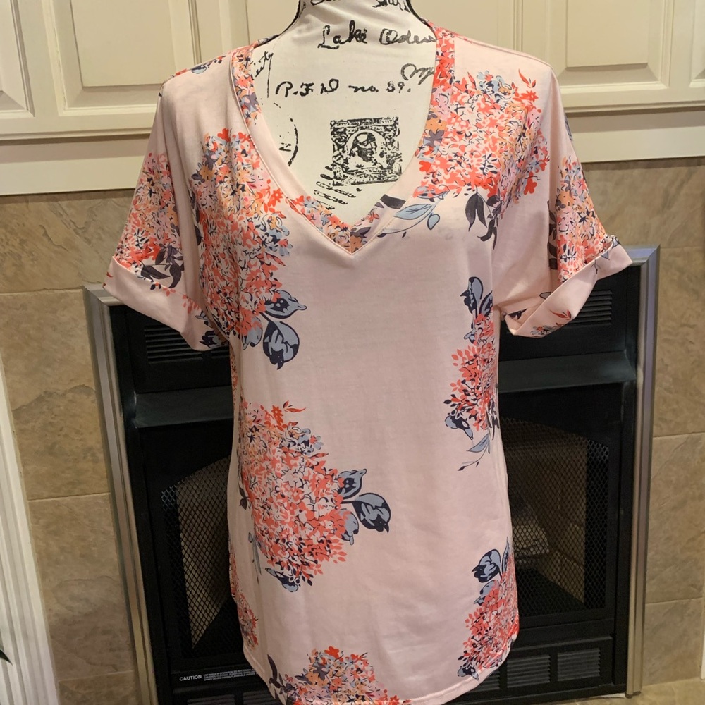 Size medium floral t-shirt. New, never worn.